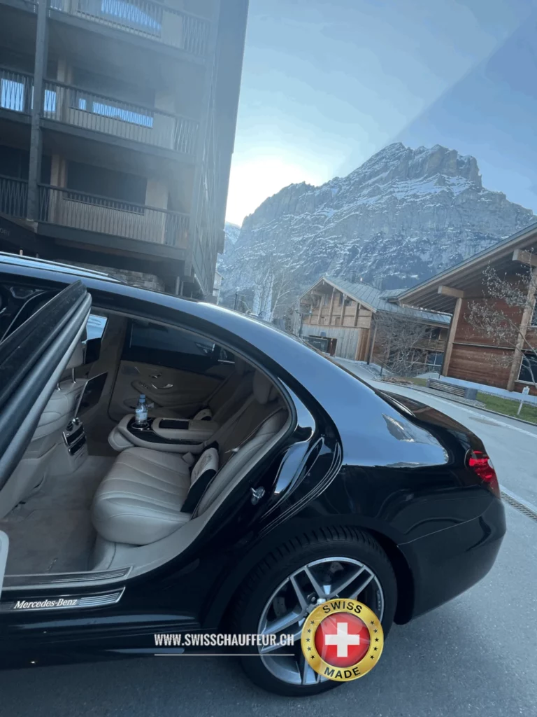 Luxury chauffeur driving a VIP client in a Mercedes-Benz S-Class in Switzerland
