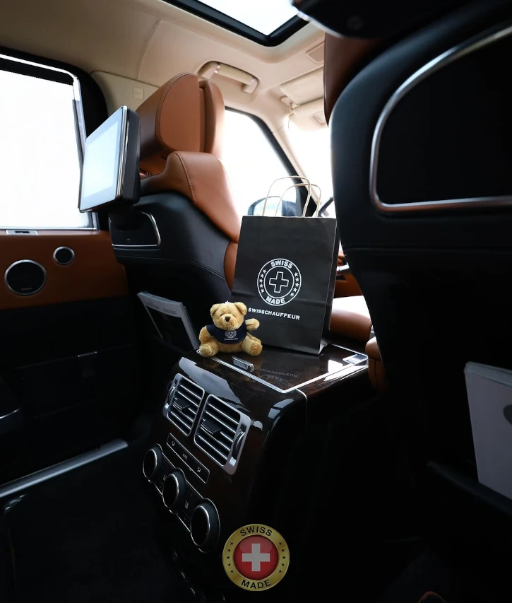 Executive chauffeur service car interior with Swiss Chauffeur gift bag