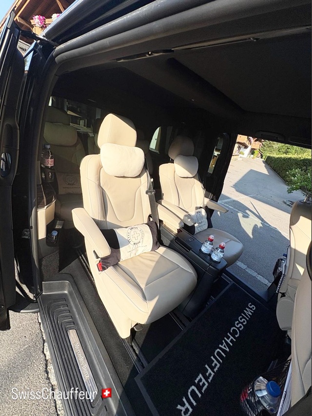 Refined interior of a Mercedes-Benz V-Class Exclusive with beige leather captain seats, prepared for private chauffeur travel in Switzerland.
