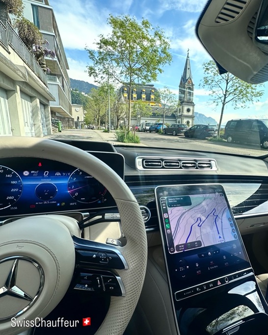 Ivory leather interior of a Mercedes-Benz S-Class 580 Maybach Edition during a private chauffeur journey through Switzerland.